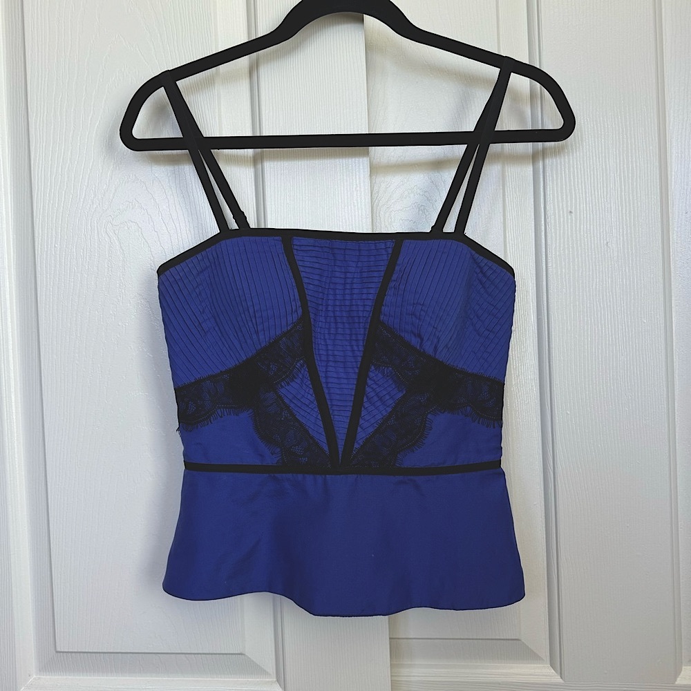 Bebe corset top, beautiful lace trims. Side zipper. Adjustable straps.
